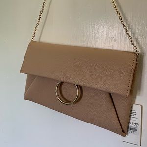 New with tag, Ring Clutch, Nude color, medium width.